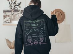 Be comfy and on-trend with this Gothic Aesthetic Hoodie featuring a back print of a pastel ombre Ouija Board. Want this shirt in another color? Send me a message! 👚 PRODUCT Gildan 18500 Unisex Pullover Hoodie *Available in sizes S - 5XL *Classic fit *Runs true to size *Medium-heavy fabric (8.0 oz/yd² (271 g/m *50% cotton, 50% polyester Design is on the back side of Hoodie. There is no design on the front. For an oversized look, go 1-2 sizes larger. All items are made to order. Props & decor sho Pastel Goth Hoodie, Occult Aesthetic, Goth Hoodie, Hoodie Back, Pastel Ombre, 9 December, Aesthetic Hoodie, Ouija Board, Gothic Aesthetic