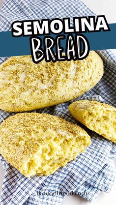 two loaves of bread sitting on top of a blue and white towel with the words semollina bread