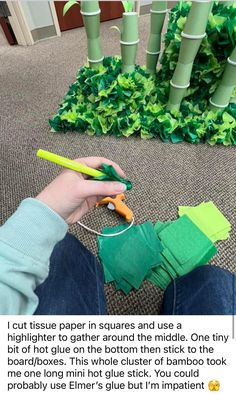 someone using scissors to cut paper in squares and use a highlighter to gather around the middle