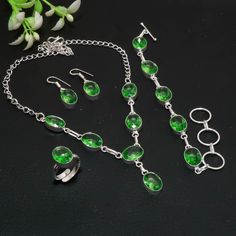 Faceted Green Amethyst Jewelry Set Necklace Bracelet Ring Earrings 925 Sterling Silver Jewelry Set Handmade Jewelry Gemstone Jewelry Set SKU:- G148 Metal:- Sterling Silver Metal Purity:- 925 Gemstone:- Green Amethyst Gemstone Color:- Green Gemstone Shape :- Oval Stone Setting :- Channel Necklace Length:- 18 Inches With Adjustable Chain Bracelet Length:- 6-8 Inches With Adjustable Chain Earrings Length:- 1.3 Inches Ring Size :- Adjustable Note We are continuously adding new products in our store. So keep coming back to see more great deals on jewelry in our Store. Amazing quality at the best price around Bulk wholesale orders are welcome on this items. Makes a great focal piece, sure to get compliments Have a great shopping with us!! Thanks for visiting our store. https://sunrisejewelshub.e Formal Green Amethyst Jewelry, May Birthstone Jewelry With Stone Setting, Green Amethyst Oval Jewelry, Green Oval Amethyst Jewelry, Sterling Silver Green Gemstone Jewelry Sets, Green Gemstone Jewelry Sets In Sterling Silver, Adjustable Sterling Silver Jewelry Sets For Gifts, Oval Gemstone Jewelry Sets As Gifts, Fine Jewelry Green Amethyst