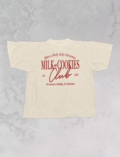 Join the Milk & Cookies club for everyone's favorite season, Christmas, in this super cozy oversized tshirt!- Features the phrase "Milk and Cookies Club, est. 1870" with "Have a Holly Jolly Christmas" above & "it's not just a holiday, it's Christmas" below all in red or white ink- Screen print transfer that is individually heat pressed onto each tshirt- Printed on a soft vintage wash tshirt, that gets softer with each wash- Oversized fit- 100% Cotton- Sizing translation: XS/S - L , S/M - XL , L/ Italian T Shirts, Cool Christmas Tshirts, Gen Z Merch, Christmas Tshirt Design Ideas, Holiday Tshirt Designs, Christmas Tshirts Designs, Christmas Graphic Tee, Christmas T-shirts, Shirt Merch Design