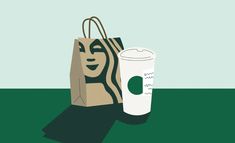 a starbucks bag and a starbucks cup sitting on the ground in front of a green background