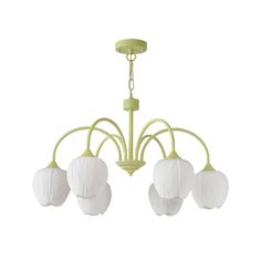 a green chandelier with five white flowers hanging from it