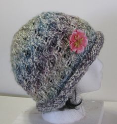 Detachable flower pin adds charm to this beautifully designedl soft bucket hat. Yarn is in shades of Cream, Tan, Blue, Purple and Rose. Medium/heavy weight soft yarn; hand wash; flat dry. One size fits most. Ready to ship. Lion Poster, Frog Design, Types Of Gifts, Cotton Hand Towels, Metal Pins, Flower Pins, Soft Yarn, Towel Set, Hand Towels