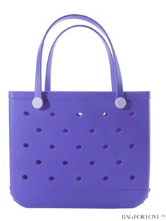 a purple tote bag with holes on the front and bottom, sitting against a white background