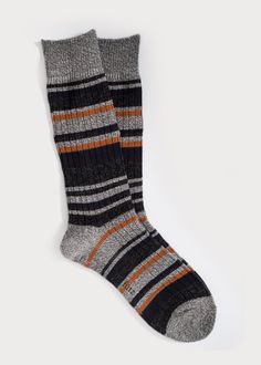 The casual comfy men's boot sock knit with non-itchy wool blend for extra warmth. Colourful accent stripes with rib makes them the perfect sock to spruce up your fall-winter style. Details: Size Guide One size fits most.Recommended Men's US shoe size 7 - 12, Euro 39 - 45. Materials 80% Acrylic, 9% Wool, 9% Polyester, 2% SpandexMade in China Care Instructions Machine wash cold, no chlorine bleach,hang dry recommended. Striped Socks For Winter Stocking Stuffer, Striped Socks For Stocking Stuffers In Winter, Brown Ribbed Winter Socks, Brown Winter Outdoor Socks, Winter Outdoor Brown Socks, Black Outdoor Socks For Fall, Black Fall Outdoor Socks, Knit Boot Socks, Boot Socks