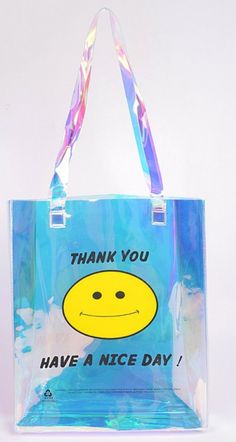 Smile Clear Pvc Tote Bag 11.75W X 14H X 3D Blue Plastic Tote Bag, Trendy Clear School Bag, Trendy Clear School Bags, Trendy Clear Plastic Shoulder Bag, Trendy White Clear Plastic Bag, Trendy White Bag In Clear Plastic, Trendy Pvc Bags For Travel, Trendy Pvc Travel Bag, Clear Plastic Bag With Large Capacity