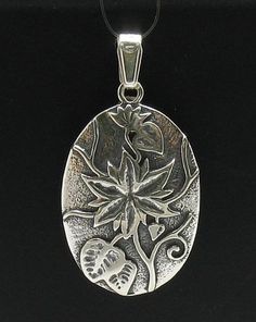 Sterling silver pendant - PE000423. APPROXIMATE WEIGHT 4.7 GRAMSDIMENSIONS 3.0X2.2CM(1.2x0.88inches) All our jewels are made from solid sterling silver 925/1000 and are carefully crafted by hand in our family workshop.We dispatch your orders in 5 working days, worldwide and the postage is $5. We ship registered priority mail. Please allow 5-7 working days for delivery in Europe and 10-15 working days outside Europe.For any questions – please do not hesitate to contact me! Engraved Sterling Silver Flower Pendant Jewelry, Collectible Silver Flower Jewelry, Sterling Silver Flower Pendant In Antique Silver, Antique Silver Sterling Flower Pendant Jewelry, Silver Flower Pendant Locket Jewelry, Silver Jewelry With Flower Pendant Locket, Silver Flower Pendant Jewelry Stamped 925, Sterling Silver Flower Pendant Locket, Silver Flower Shaped Locket Jewelry