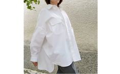 Material 97% Cotton  3% Elastane A white shirt in a wide version has become a classic part of a woman's wardrobe. Feel stylish and comfortable in this type of shirt. CARE INSTRUCTIONS - Dry clean - Hand wash Elegant Oversized Shirt With Pockets, White Shirt With Pockets For Daywear, Oversized White Casual Blouse, Oversized White Blouse With Pockets, Oversized White Shirt With Pockets, Oversized Casual Office Shirt, Casual Oversized Shirt For Office, Classic White Oversized Shirt, Oversized White Blouse For Workwear