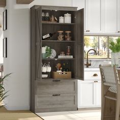 an open cabinet in the middle of a kitchen next to a dining room table and chairs