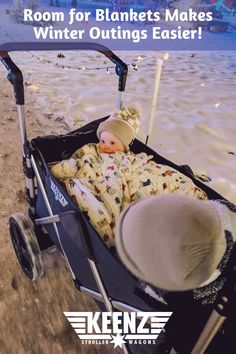 A baby and a kid inside a Keenz 7S 2.0 2-Passenger Stroller Wagon at night in the snow. Room for blankets makes winter outings easier! Keenz. The Beach