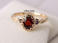 Welcome to my shop, you can find many beautiful gemstone jewelry here, and you also can ask for customized service.  Main Stone: natural garnet, oval cut, measures 6X8 mm, weight 1.74 carats. Accent Stones: Lab alexandrite and cz Metal: 14k solid yellow gold/white/rose gold/sterling silver Setting: half bezel setting  more rings: https://www.etsy.com/shop/XCjewelryStudio?ref=hdr_shop_menu It's quite comfortable for wearing and suitable for all occasions (wedding, anniversary, Christmas) styles a White Stone Finger Ring Gold, Silver Garnet Engagement Ring, Vintage Garnet Rings, Garnet Ring Gold, Gem Stone Ring, Christmas Styles, Meaningful Rings, Garnet Wedding Rings, Garnet Ring Vintage