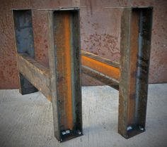 two metal benches sitting next to each other