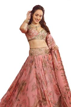 Pink lehenga with all over floral garden prints, elevated with an embroidered broad waistband using sequins, mirror. Paired with a blouse with printed base and sequin, mirror embroidery. Comes along with a dupatta with floral, sequin embroidered buttis. - Aza Fashions Semi-stitched Floral Print Sharara For Wedding, Navratri Floral Print Georgette Lehenga, Fitted Floral Print Anarkali Set With Traditional Drape, Floral Print Floor-length Sharara For Wedding, Wedding Floral Print Saree Set, Pink Floral Print Lehenga With Traditional Drape, Bollywood Style Floral Print Georgette Lehenga, Bollywood Style Floral Georgette Lehenga, Fitted Floral Print Sharara For Navratri