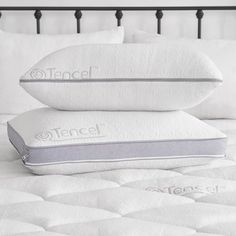 two pillows are stacked on top of each other