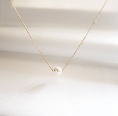 Simple but very elegant necklace that is perfect for bridal gifts and everyday wear.// ITEM DETAILS //*This listing item for White Pearl Necklace, but you can select the defferent colors of the pearl (see photo4)- Genuine White Swarovski Crystal Pearl measures 8mm- 14K Gold Fill, 14k Rose Gold Fill, Sterling Silver chain and findings  Also, available in Gold Plated, Rose gold Plated, Silver Plated chain and findings- Beautiful gift wrapped with note in the box// LENGTH //- Length shown in the ph White Jewelry With Adjustable Chain For Bridesmaid Gift, Dainty White Necklace For Bridesmaid Gift, Classic Pendant Bridal Necklace As Gift, Classic Pendant Bridal Necklace Gift, White Minimalist Necklace For Party, Elegant Pearl White Bridal Necklace For Bridesmaid Gift, Classic Bridal Pendant Necklace Gift, Minimalist White Necklace For Party, Minimalist White Necklaces For Party