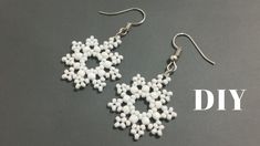 white beaded snowflake earrings are displayed on a gray background with the words diy written below it