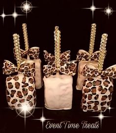 four bags with leopard print bows on them and the words event time treats written in gold