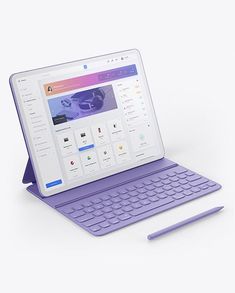 an open laptop computer sitting on top of a white table next to a purple keyboard