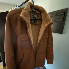 Size Large. Fits Snug. Very Warm. Perfect Condition. Feels Great Like Real Suede. Casual Leather Outerwear With Faux Fur Lining, Winter Faux Leather Outerwear With Faux Fur Trim, Faux Leather Outerwear With Faux Fur Lining, Brown Leather Jacket With Fleece Lining For Cold Weather, Faux Leather Outerwear For Cold Winter Weather, Faux Leather Outerwear For Winter, Brown Faux Leather Winter Outerwear, Casual Shearling Outerwear With Faux Fur Lining, Brown Faux Leather Outerwear For Winter