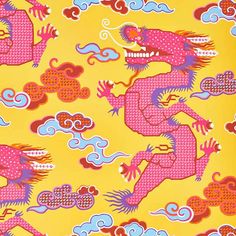 a yellow background with pink and red dragon designs on it's sides, in the middle of clouds