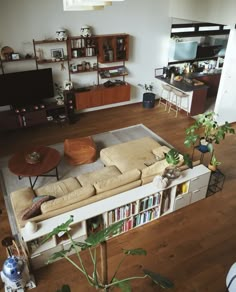 a living room filled with furniture and a flat screen tv