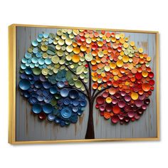 a colorful tree made out of bottle caps is displayed on a wooden paneled wall