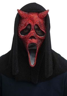 a man wearing a red devil mask with his mouth open