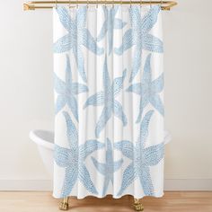 a shower curtain with blue starfishs on it