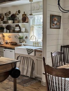 the kitchen is clean and ready to be used for cooking or baking, while also being used as a dining area