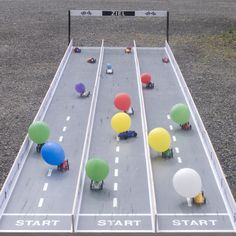 an aerial view of balloons on the road