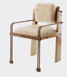 a wooden chair with sheep fur on it's back and arms, against a white background