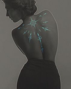 the back of a woman's body with blue flowers painted on her upper and lower back