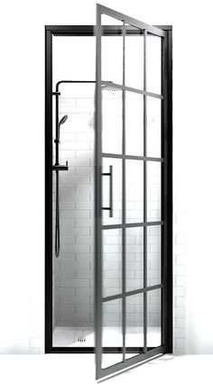 an open shower door in a bathroom with white tiles and black trimmings on the walls