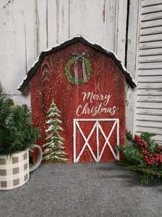 a red barn with christmas decorations on it