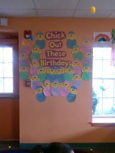 a child is sitting in front of a birthday card board with teddy bears on it