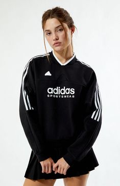 Stay cozy and stylish in the Tiro Fleece Sweatshirt from adidas. Featuring a flattering V-neckline and long sleeves with dropped shoulders, this sweatshirt offers a relaxed fit for all-day comfort. The iconic 3-Stripes down the sleeves and adidas logo graphic add a sporty touch, while the adidas rubber brand label ensures authenticity.Solid color sweatshirtV-necklineLong sleevesDropped shouldersadidas graphic and rubber brand labelRibbed trimming70% cotton, 30% recycled polyesterMachine washableModel is wearing a size smallModel measurements: 5’6.5” height, 32” bust, 23.5” waist, 35” hipLearn more about PacSun eco items adidas Womens Tiro Fleece Sweatshirt - Black size Small Black Clothes For Women, Adidas Black Sweatshirt For Sports, Black Adidas Crew Neck Sweatshirt, Sporty Black Adidas Sweatshirt, Black Adidas Sweatshirt Sportswear, Black Long Sleeve Adidas Logo Sweatshirt, Adidas Sweatshirt, Adidas Sportswear, Chill Fits