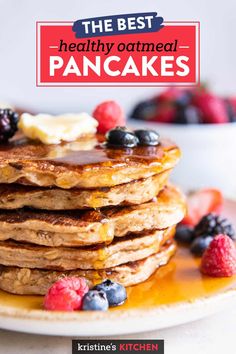 the best healthy oatmeal pancakes with berries and blueberries on a plate