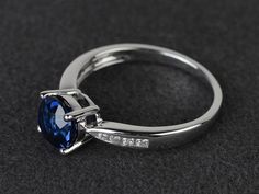 Welcome to my shop, you can find many beautiful gemstone jewelry here, and you also can ask for customized service. Main Stone: lab created sapphire, round cut, measures 7X7mm, weight about 1.64 carats.Accent Stones: czMetal: 925 sterling silver plated with rhodium. I also can provide metal options such as 14k solid yellow/white/rose goldSetting: prong settingmore rings: https://www.etsy.com/shop/XCjewelryStudio?ref=hdr_shop_menuIt's a perfect gift for the person who was born in September (Birth Formal Lab-created Sapphire Round Ring, Formal Round Lab-created Sapphire Ring, Sapphire Topaz Round Ring For Promise, Sapphire Topaz Promise Ring, Fine Jewelry Sapphire Topaz Round Ring, Sapphire Topaz Ring For Promise, Round Sapphire Gemstone Ring, Round Lab-created Sapphire Ring, Blue Lab-created Sapphire Birthstone Ring