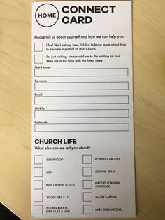 a church life card sitting on top of a wooden table