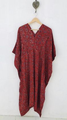 Block print Ajarakh silk blend kaftan - luxury loungewear - organic dyed Long Kaftan in a woven silk and cotton blend with a slight sheen. V neck with a tie knot around waist for gently draped effect. Size : One size fits all Chest (56 inch) Length (44 inch) Fabric : Modal silk - hand washable, soft against skin, wrinkle resistant & breathable fabric. Can be worn as a swim suit cover up ora dress! Ajarakh is a block printed textile that is resist dyed using natural dyes( minerals, scrap iron Bohemian V-neck Robe For Loungewear, Long Bohemian Block Print Kimono, Oversized Silk Bohemian Kaftan, Bohemian Batik Print Patterned Kaftan, Long Bohemian Patterned Kaftan, Patterned Kaftan With Kimono Sleeves For Festival, Festival Patterned Kaftan With Kimono Sleeves, Bohemian Kimono With Natural Dye And Relaxed Fit, Bohemian Kimono With Natural Dye In Relaxed Fit