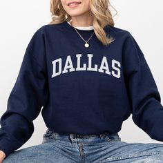 This Dallas sweatshirt is the perfect way to embrace the iconic Dallas skyline. Crafted with premium materials, this cozy Dallas crewneck offers both comfort and a touch of casual style. Whether you're taking in the city's impressive architecture, enjoying local attractions, or simply expressing your love for Dallas, our Dallas shirt is the ideal choice. Ideal for most situations, a unisex heavy blend Texas crewneck sweater is pure comfort. These garments are made from polyester and cotton. This combination helps designs come out looking fresh and beautiful. The collar is ribbed knit, so it retains its shape even after washing. There are no itchy side seams on these sweaters. - 50% cotton, 50% polyester - Medium-heavy fabric (8.0 oz/yd² (271.25 g/m - Loose fit - Sewn-in label Fit Note: If Fall Fleece Sweater With Logo Print, Trendy Campus Sweatshirt For Fall, Trendy Sweatshirt For Campus In Fall, Trendy Fall Sweatshirt For Campus, Fall Logo Print Crew Neck Sweats, Varsity French Terry Sweatshirt For Fall, Fall Varsity Sweatshirt In French Terry, Fall Crew Neck Sweats With Logo Print, College Long Sleeve Logo Print Sweatshirt