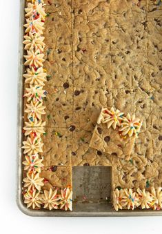 a cookie sheet with sprinkles and bows on it is ready to be baked