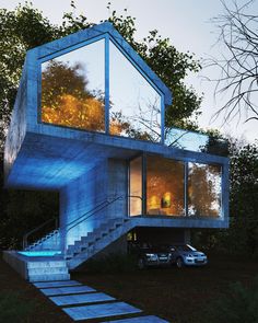 a blue house with stairs leading up to the upper floor and an open window on top