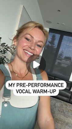 a woman holding up a cell phone in front of her face with the caption my pre - performance vocal warm - up