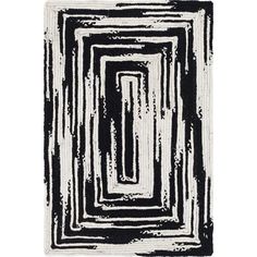 a black and white rug with an abstract design