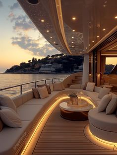 the inside of a boat with couches, tables and lamps on it's deck