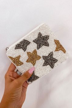 Talk about FUN!! Our beaded pouches are perfect to hold your money, makeup, smaller bag to go into your purse, AND more! Add some spice to your outfit with one of our Wanderlust pouches! Beaded material Silver zipper Interior is fabric lined "Sassy" and "Savage" have puff pink pom-pom accent on the zipper 4.5" tall by Beaded Mini Bag, Embroidery Makeup Bag, Beaded Embroidery Bag, Bead Embroidery Bag, Bead Embroidery Ideas, Diy Beaded Bag, Crochet Makeup Bag, Beaded Pouch Bag, Beaded Wallet