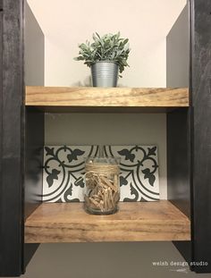 a wooden shelf with a potted plant on top