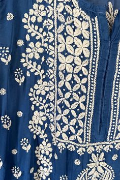 This Blue Satin Silk Lucknowi Chikankari Ladies Straight Kurta is an elegant and versatile choice for any occasion. Made from skin-friendly satin silk and adorned with intricate Lucknowi chikankari handwork embroidery, it promises both comfort and style. Satin Silk Length 46" inches Long sleeves 18" inches Round neck Side slit All over handwork Chikankari embroidery Margin: no Dry clean Phulkari Pants, Lucknowi Kurta, Gharara Suits, Patiala Salwar Suits, Chikankari Embroidery, Bridal Dupatta, Phulkari Dupatta, Chikankari Suits, Lucknowi Chikankari